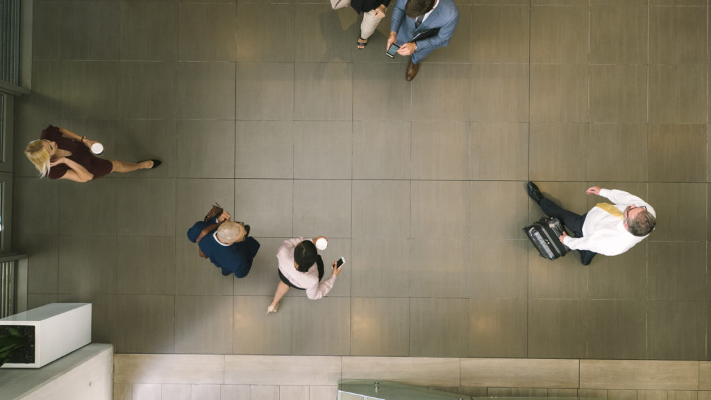 top view of people walking through building